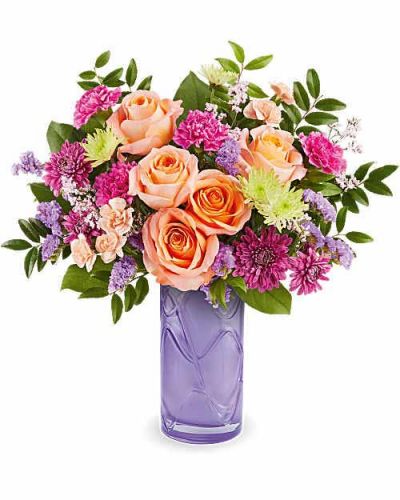 Celebrate her sweetest moments with Teleflora's Pretty Daydream Bouquet, a dreamy mix of soft, vibrant blooms beautifully arranged in Teleflora's Pretty Daydream Vase-a charming keepsake she'll enjoy long after Mother's Day.