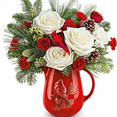 Teleflora's Scarlet Cardinal Bouquet celebrates the season with festive red blooms and winter greens in a keepsake Scarlet Cardinal Pitcher. A heartfelt gift for Christmas or anyone who cherishes holiday tradition.