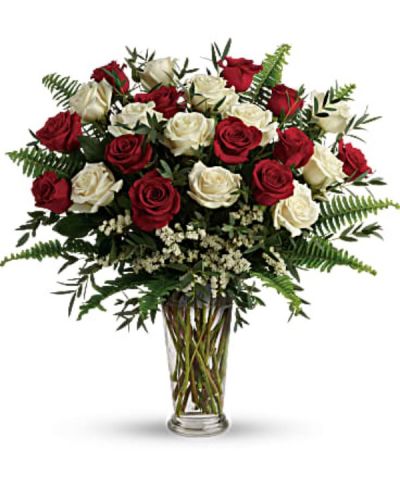 <div id="mark-1" class="m-pdp-tabs-marketing-description">A truly breathtaking tribute to your love, this romantic arrangement bursts with a dozen and a half red and white roses, nestled among delicate greens.</div>
<div id="desc-1">
<ul>
 	<li>This bouquet includes red roses, white roses, white sinuata statice, parvifolia eucalyptus, and sword fern.</li>
 	<li>Delivered in a clear romanesque vase.</li>
</ul>
</div>