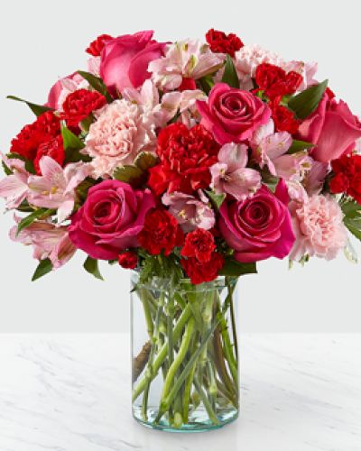 Handcrafted and inspired by the gorgeous hues of the season, the You’re Precious Bouquet is full of sweet sentiment for your favorite person. Hot pink roses, red carnations, pink alstroemeria, and pale pink carnations come together in a clear glass vase to make any room feel beautiful and light. From special birthdays to simply just because, this arrangement is a stunning gift to give your loved ones for every occasion.