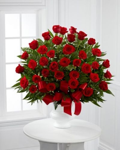 Each rose in our Blessed with Love™ is a touching way to share your expressions of sympathy for a cherished loved one. Accented by a collection of luscious greens, the red blooms are carefully placed by a local florist and delivered right to the service.