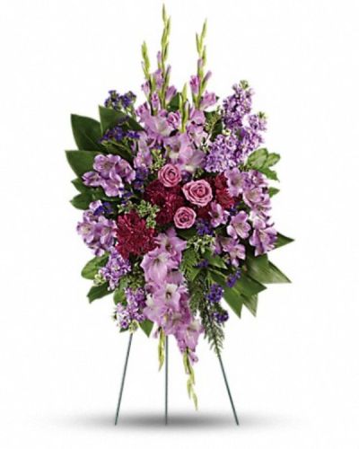 <div class="m-pdp-tabs-description">
<div id="mark-1" class="m-pdp-tabs-marketing-description" style="text-align: right">Console and comfort with this luxurious spray of lavender roses, alstroemeria and gladioli. It's a majestic way to remember the departed at the memorial service.</div>
</div>
<p id="arrngDescp">This regal spray includes lavender roses, lavender alstroemeria, lavender gladioli, lavender stock, purple cushion spray chrysanthemums, purple sinuata statice, green ti leaves, flat cedar, oregonia and lemon leaf.</p>