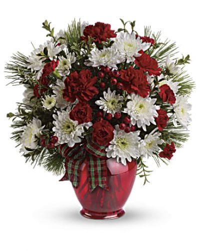 A joy to give and receive, this very merry arrangement delights with fresh flowers, winter greens and red berries in our charming red ginger jar vase.
