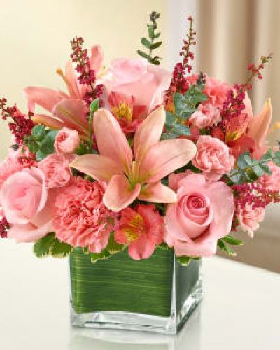 Let the vibrant beauty of our graceful all-pink bouquet convey your deepest love.

Help heal with this cube vase arrangement of pink roses, lilies, alstroemeria, carnations and heather.