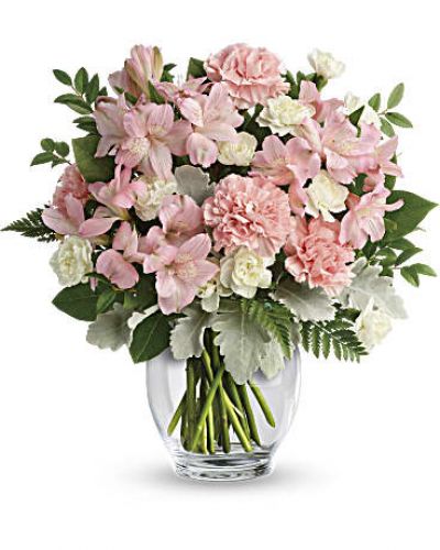 In the prettiest shade of whisper-soft pink, this breathtaking bouquet proclaims your affection in a most powerful way!
This delicate arrangement includes pink alstroemeria, pink carnations, white miniature carnations, dusty miller, huckleberry, leatherleaf fern, and lemon leaf.