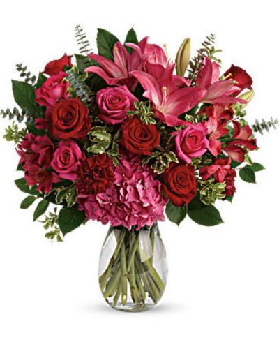 <div class="m-pdp-tabs-description">
<div id="mark-2" class="m-pdp-tabs-marketing-description">A luxurious bouquet that's sure to leave your special someone absolutely love struck! There's no denying the dramatic beauty of these radiant, red hot roses, hydrangea and lilies.</div>
</div>
<p id="arrngDescp">This luxe arrangement includes pink hydrangea, hot pink roses, red roses, dark pink asiatic lilies, dark pink alstroemeria, maroon carnations, pitta negra, spiral eucalyptus, and lemon leaf. Delivered in a glass jordan vase.</p>