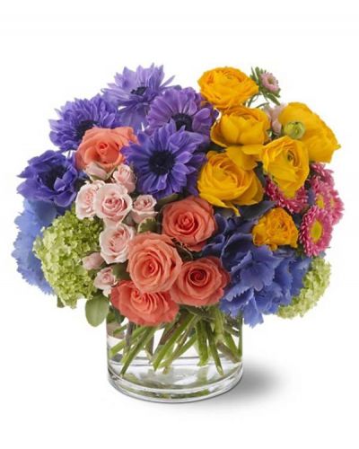 Add a bit of poetry to someone's day with this spectacular bouquet featuring pink roses. Gathered with whimsical purple anemone, sunny yellow ranunculus and more, it's a perfect sonnet of color delivered in a glass cylinder vase.