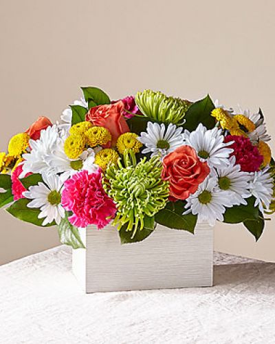 What's the scoop on this bright arrangement Well, our Sorbet Bouquet is curated with a full serving of freshness and fragrance by our local florists to make anyone's day sweeter. This design features roses, spider mums, carnations and poms in a whitewashed wooden box.
