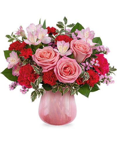 Radiating soft sophistication, Teleflora's Pretty In Petal Bouquet blends pink roses, alstroemeria, and carnations in a translucent crackled glass vase with a pink gradient-a chic and heartfelt Valentine's Day gift for your one and only.