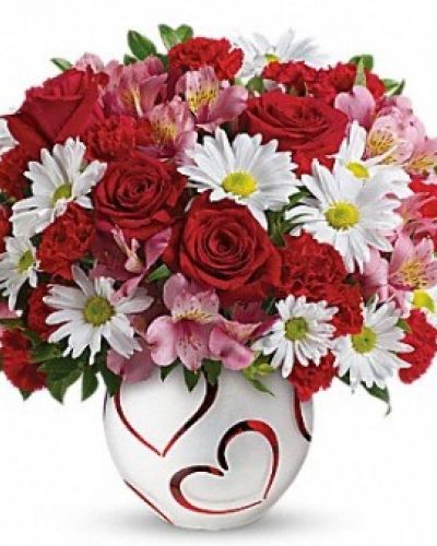 Send some loving hearts! Perfect for Valentine's Day this bright, beautiful bouquet of red roses and pink alstroemeria delivered in a cute heart-adorned bowl is sure to put some happy in a special someone's heart!

Red roses, pink alstroemeria, miniature red carnations and white daisy spray chrysanthemums are arranged with huckleberry. Delivered in a Happy Hearts bowl.