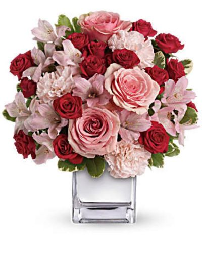 <div id="mark-3" class="m-pdp-tabs-marketing-description">Think pink, then think of all the thank-you kisses you'll get when you send this ravishingly romantic bouquet. Lush pink and red roses, pink alstroemeria and pink carnations in a chic mirrored silver cube. Get ready to pucker up.</div>
<div id="desc-3">
<ul>
 	<li>This impressive bouquet includes pink roses, red spray roses, pink alstroemeria and pink carnations accented with assorted greenery.</li>
</ul>
</div>